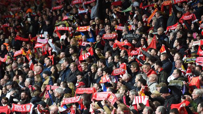 People Liverpool fans on the Kop at the final Hillsborough memorial to be held at Anfield.