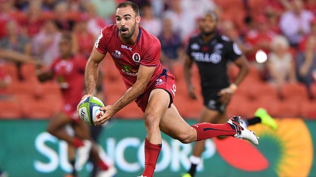 Reds player Nick Frisby into space during the 1st round Super Rugby match between the Queensland Reds and the Sharks from South Africa, at Suncorp Stadium in Brisbane, Friday, Feb. 24, 2017. (AAP Image/Dave Hunt) NO ARCHIVING, EDITORIAL USE ONLY