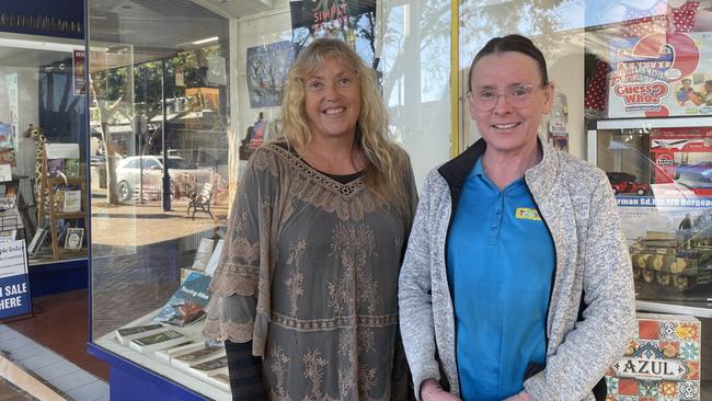 Adele Coombs and Kerry Johnston of Twiga Books and Toyworld are concerned about when the burnt out building will be fixed and whether it affects the security of Mary Street. Picture: Christine Schindler