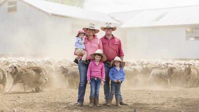 Kate and Spike Orr with their kids Archie, Anna and Lachie in the sheep yards at their property. Picture: Kim Storey