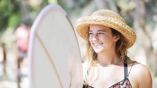 Former world longboard champion Rachael Tilly with her custom-made board by shaper Joshua Lopez.