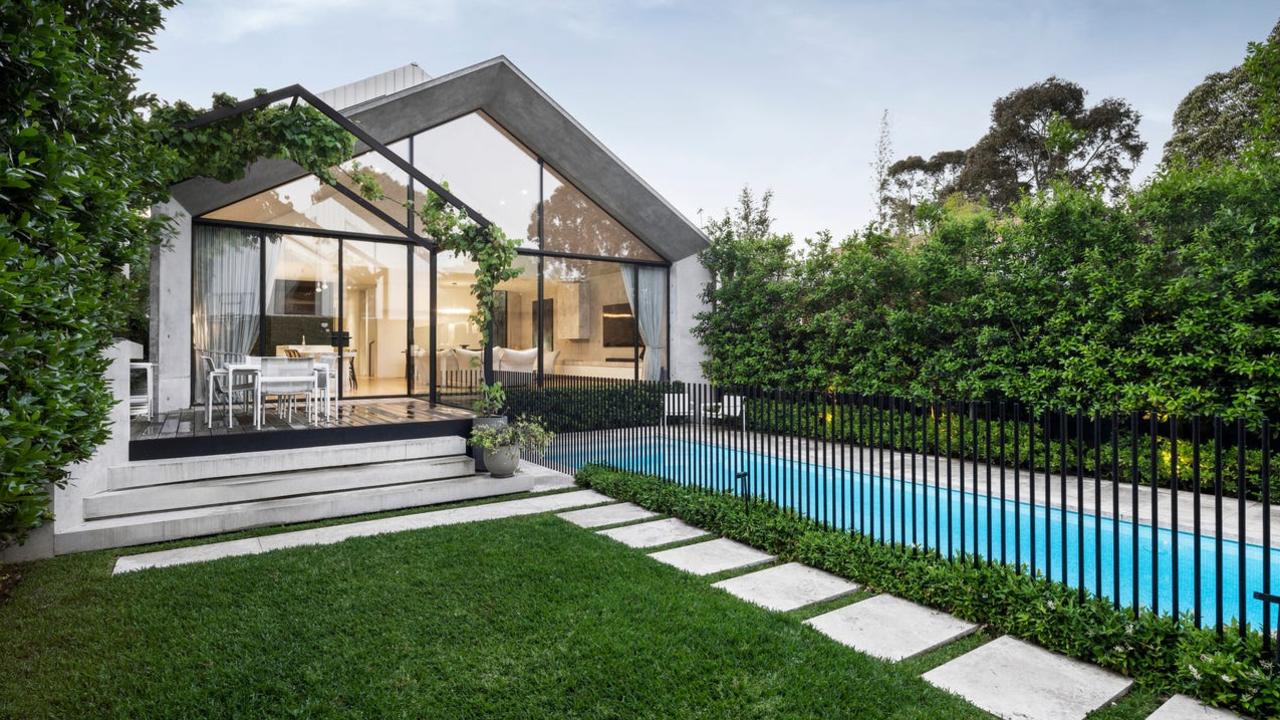 The back yard with step stones to the pool.