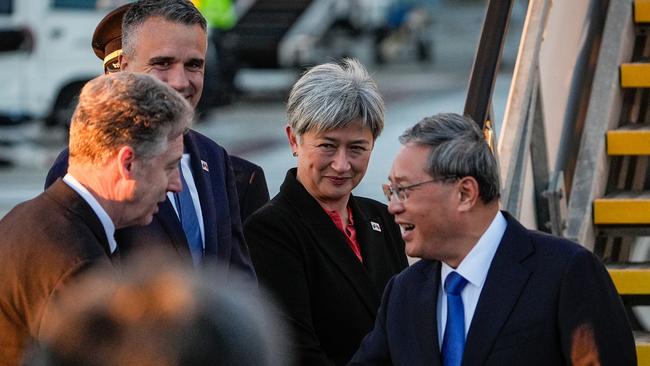 China's Premier Li Qiang (R) greets Australia's Foreign Minister Penny Wong (C), South Australia's Premier Peter Malinauskas (2nd L) and other officials at Adelaide Airport. Picture: Getty Images.