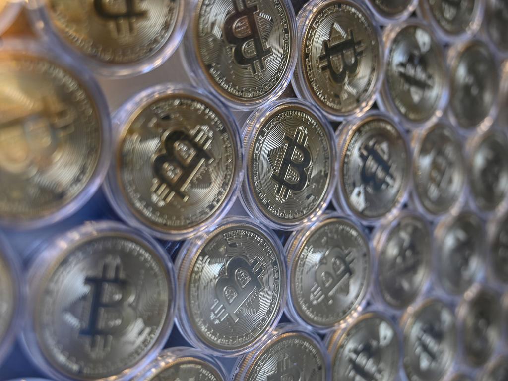 The Australian Federal Police said the man allegedly transferred the cash he stole from using the illegal malware into Bitcoin before sending it offshore. Picture: Ozan KOSE / AFP