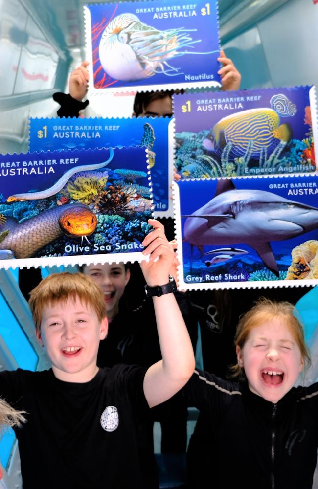 Kids with oversized Reef Safari stamps.