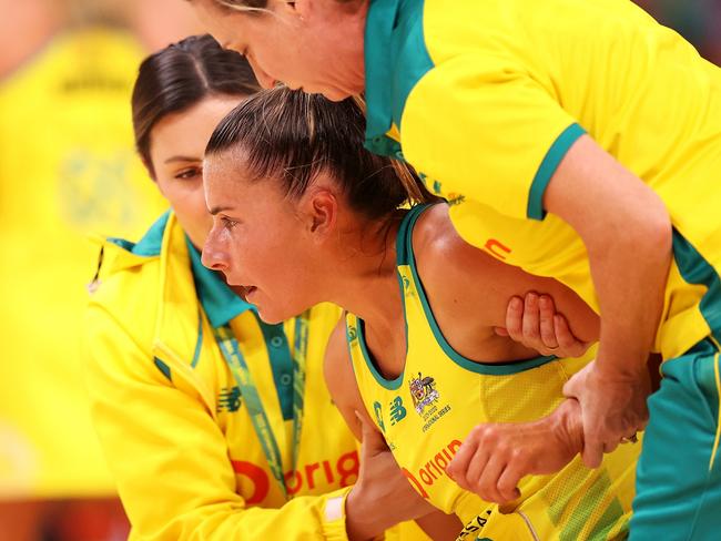 SYDNEY, AUSTRALIA - OCTOBER 30: Maddy Proud of Australia is helped to her feet during game two of the International Test series between the Australia Diamonds and the England Roses at Qudos Bank Arena on October 30, 2022 in Sydney, Australia. (Photo by Mark Kolbe/Getty Images for Netball Australia)