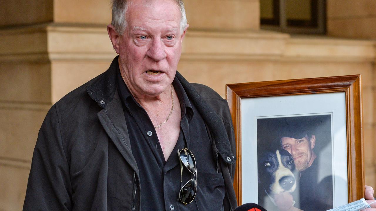 Malcolm Boyce, father of Mark Boyce, with a picture of his son outside the Supreme Court on Friday after giving a victim impact statement. Picture: Brenton Edwards