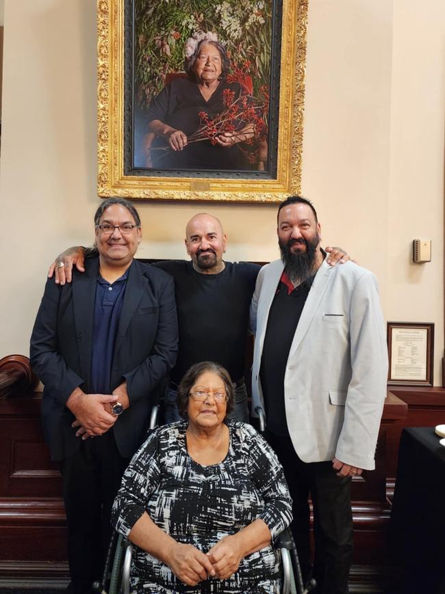 Aunty Shirley Paisley with three of her sons, including Damien (R) at her portrait unveiling. Picture: Supplied