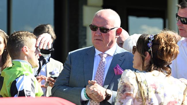 Owner Noel Greenhalgh (centre) speaks to jockey James McDonald (left) after Imperalist’s win in the Phoenix at Eagle Farm on Saturday. Picture: Grant Peters / Trackside Photography