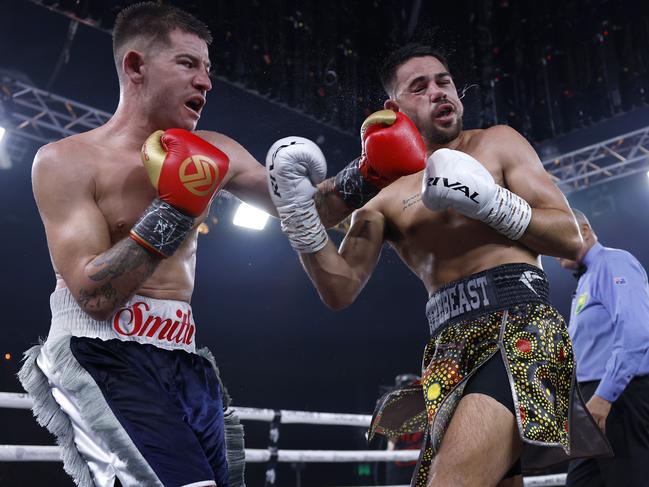 Mason Smith lands a blow on Hussain. Picture: No Limit Boxing