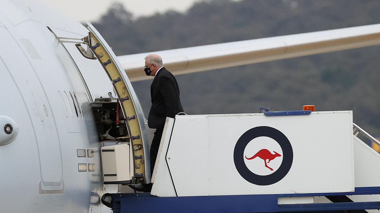 Prime Minister Scott Morrison boards a RAAF aircraft to fly to Europe, where he will attend the COP26 UN Climate Change Conference in Glasgow. Picture: NCA NewsWire / Gary Ramage