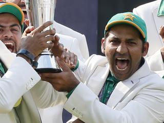 Pakistan's captain Sarfraz Ahmed, front center, celebrates with teammates during the award ceremony for the ICC Champions Trophy at The Oval in London, Sunday, June 18, 2017. Pakistan won the final by crushing India for 180 runs. (AP Photo/Kirsty Wigglesworth)