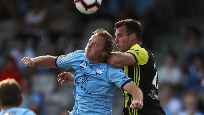 Sydney FC’s Rhyan Grant gets a header in front of Steven Taylor. Picture: Getty Images