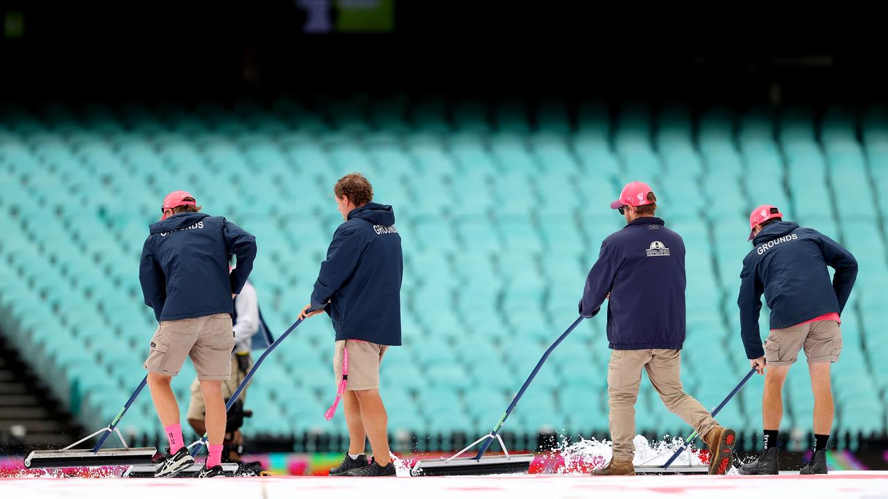 Ground staff work to dry the field during day four of the Third Test. Picture: Getty