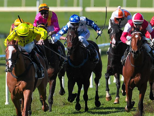 Jockey Jim Byrne rides She's Our Star (far left) to win race 3, The Caltex - Eagle Farm QTIS Two-Years-Old Handicap during the Doomben Race Day at Doomben Racecourse in Brisbane, Saturday, July 8, 2017. (AAP Image/Albert Perez) NO ARCHIVING, EDITORIAL USE ONLY