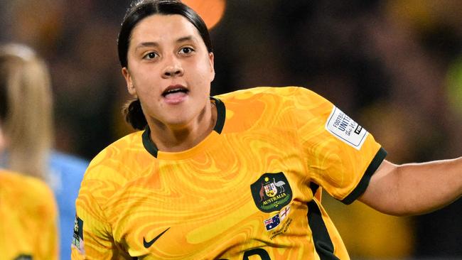 FILES-- This file photo taken on August 16, 2023 shows Australia's forward Sam Kerr celebrating scoring her team's first goal during the Australia and New Zealand 2023 Women's World Cup semi-final football match between Australia and England at Stadium Australia in Sydney. Chelsea and Australian women's football star Sam Kerr has been charged with a "racially aggravated offence" in Britain following a dispute involving a police officer, London's Metropolitan Police said March 4. The 30-year-old striker, one of the highest profile and best-paid players in the women's game, was charged following an incident in London in January 2023, a police statement read. (Photo by IZHAR KHAN / AFP)