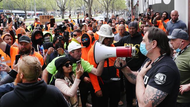 CFMEU boss John Setka tries to quell the angry crowd outside his office. Picture: David Crosling