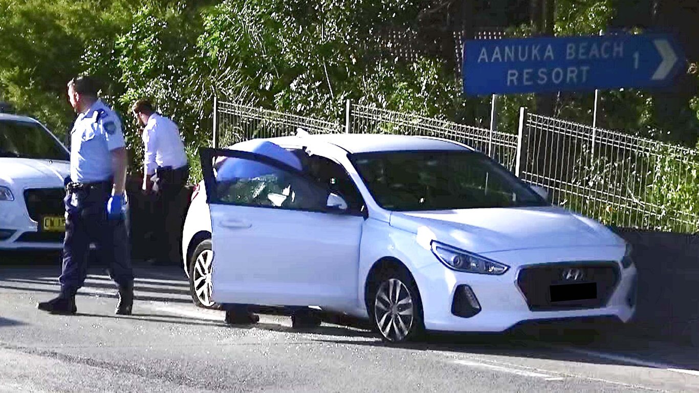 Officers from Coffs/Clarence Traffic and Highway Patrol following an alleged high speed pursuit which started at Glenugie and ended near the Big Banana at Coffs Harbour. Photo: Frank Redward