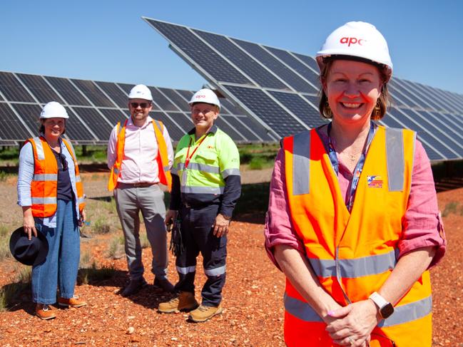 (Front) Mayor Peta MacRae with (back L-R) The Next Economy's Lizzie Webb, Mount Isa Council's Chad King and APA's Sam Floriani at a new 88MW solar farm outside town.