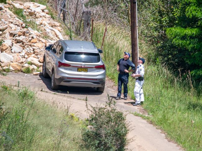 Police fly a drone in search for a body on a property in Upper Colo on Friday. Picture: Thomas Lisson