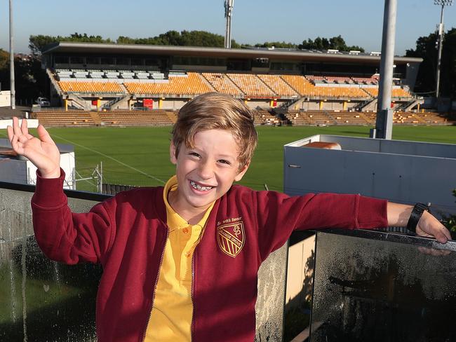 Eight year-old Harry Granger on the balcony of his home with the best view of Leichhardt Oval which will be closed to the public for the NRL. Picture: Brett Costello