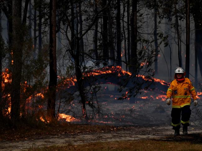 Rural Fire Service (RFS) firefighters conduct property protection near the town of Sussex Inlet. Picture: Sam Mooy/Getty