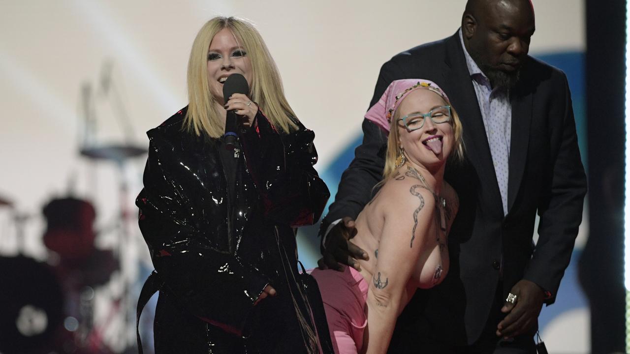 The protester was eventually escorted from the stage (Photo by Dale MacMillan/Getty Images)