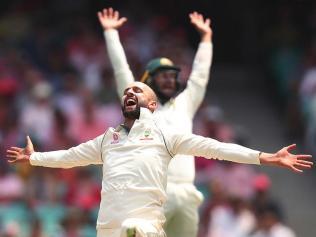 Nathan Lyon celebrates taking his first five-for at the SCG.