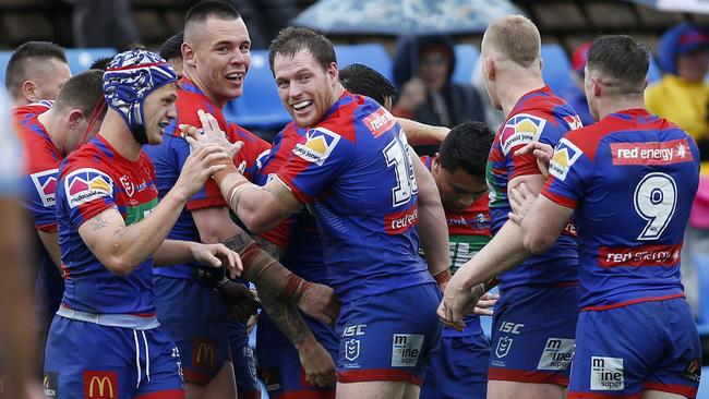 Knights players celebrate a try to Hymel Hunt during the Round 24 NRL match between the Newcastle Knights and the Gold Coast Titans at McDonald Jones Stadium in Newcastle, Saturday, August 31, 2019. (AAP Image/Darren Pateman) NO ARCHIVING, EDITORIAL USE ONLY