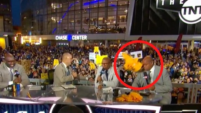 Charles Barkley is pelted with t-shirts.