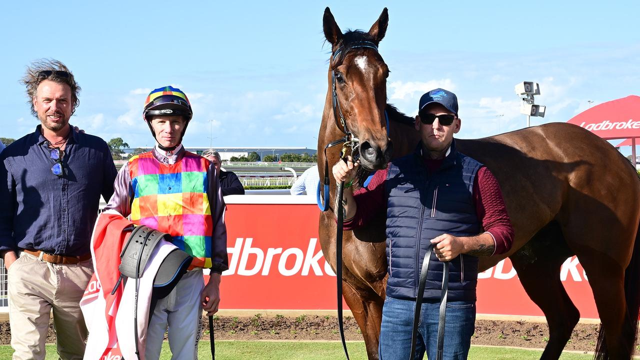 Supplied Editorial Jeff Allis (left) celebrates the win of Tiger Shark at Doomben.
 Picture: Grant Peters - Trackside Photography