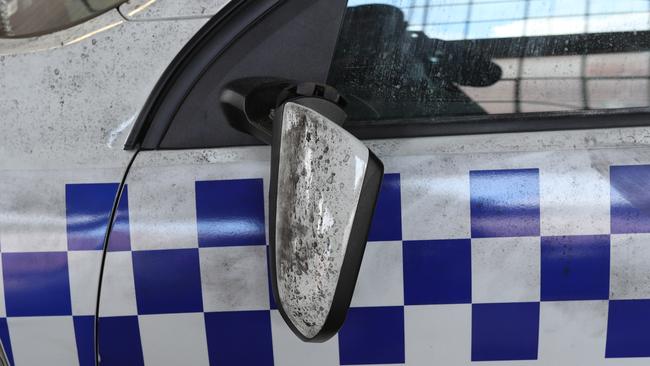 The side mirror of one police car was also destroyed. Picture: David Crosling