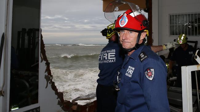 Anthony Waller, current Governor and former President of Coogee SLSC inspects the damage in his capacity as a NSW Fire Brigade specialist team leader. Picture: Craig Wilson