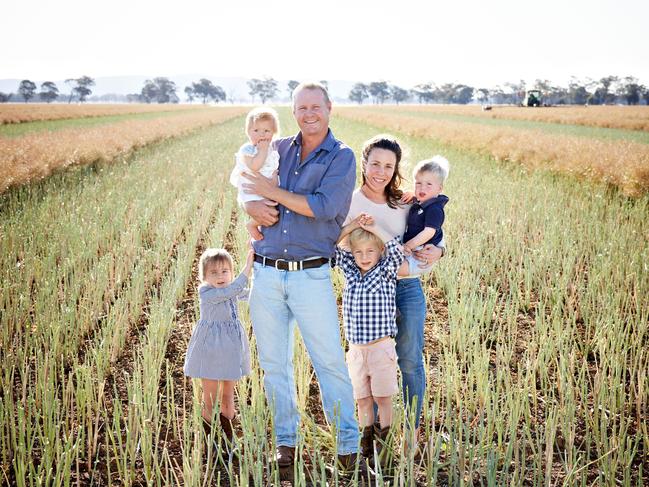 Canola farmers Rick and Alice Mattiske on their property Geraldra at Stockinbingal near Temora in the south-west slopes of NSW, with their children (left to right) Fleur, 3, Grace, 1, Walter, 5, and George, 2. Picture: Graham Schumann