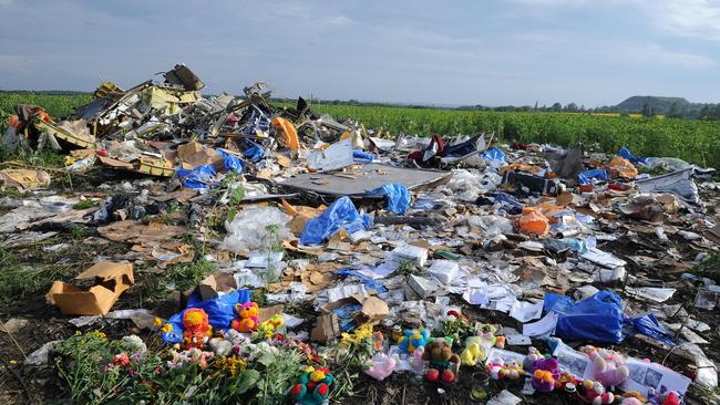 Flowers and plush toys that were left at the crash site of the Malaysia Airlines MH17 in 2014. Picture: AFP