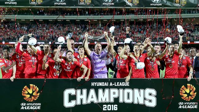 An injured Michael Marrone (second from right) celebrates Adelaide United’s 2016 A-League grand final triumph with his Reds teammates. Picture: Sarah Reed