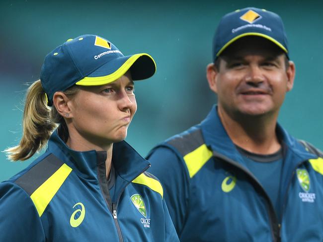 Australian captain Meg Lanning and coach Matthew Mott inspect the playing surface ahead of the Women's T20 World Cup Semi-Final 2 match between Australia and South Africa at the SCG in Sydney, Thursday, March 5, 2020. (AAP Image/Dan Himbrechts) NO ARCHIVING, EDITORIAL USE ONLY, IMAGES TO BE USED FOR NEWS REPORTING PURPOSES ONLY, NO COMMERCIAL USE WHATSOEVER, NO USE IN BOOKS WITHOUT PRIOR WRITTEN CONSENT FROM AAP