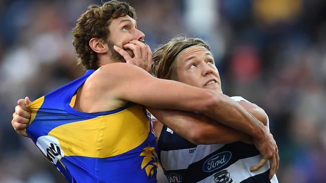 Tom Hickey of the Eagles competes in the ruck against Rhys Stanley of the Cats.