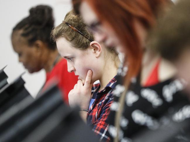 Nine states have already opened to voters with heavy turnout leading to queues. Pictured, Jessica Hoffman votes in Ohio. Picture: AP Photo/John Minchillo.