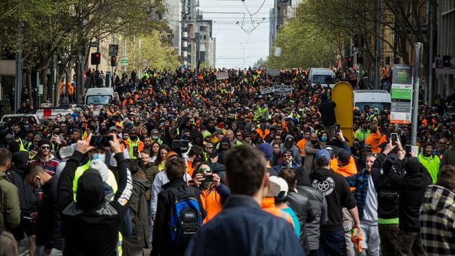 Thousands of men in hi-vis outfits join the march. Picture: Getty Images