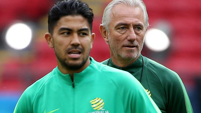 The Socceroos train on Kazan Arena ahead of their opening match of the World Cup against France. Coach Bert van Marwijk keeps an eye on the players including Massimo Luongo. Picture: Toby Zerna
