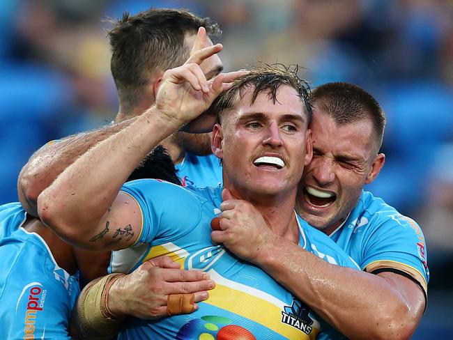 GOLD COAST, AUSTRALIA - MAY 12: AJ Brimson of the Titans celebrates a try during the round 10 NRL match between Gold Coast Titans and North Queensland Cowboys at Cbus Super Stadium, on May 12, 2024, in Gold Coast, Australia. (Photo by Chris Hyde/Getty Images)