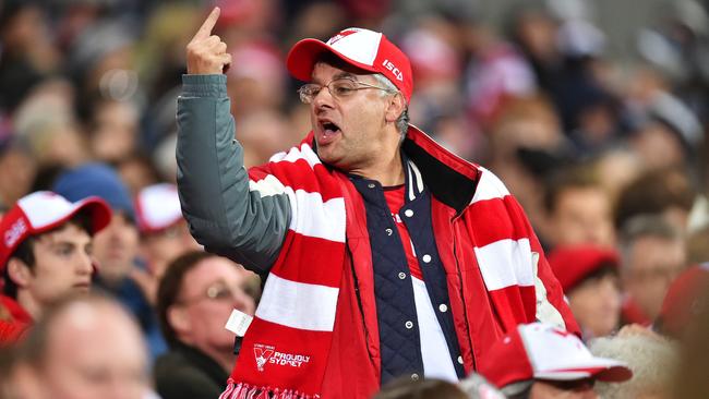 An angry Sydney Swans fan gestures during a match. Picture: Nigel Hallett