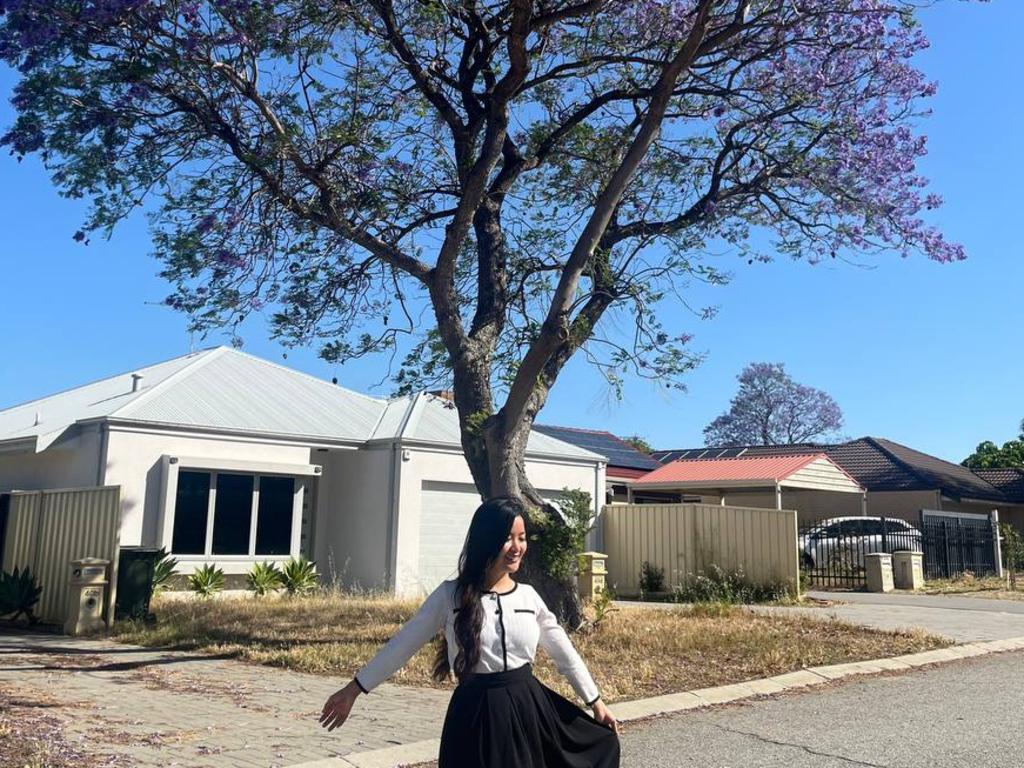 Jacqueline enjoying the Jacarandas in Australia.