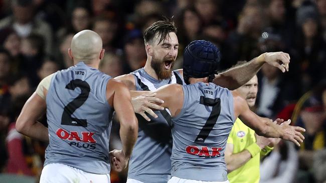 Port Adelaide players celebrating during their Showdown 47 win last year. Picture: Sarah Reed