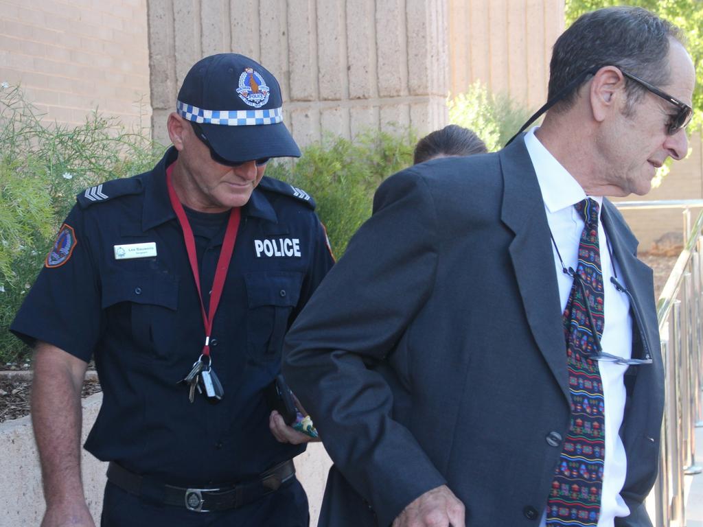 NT Police sergeant Lee Bauwens outside the Alice Springs Local Court with his legal team after giving evidence at an inquest into the death of Kumanjayi Walker. Picture: Jason Walls