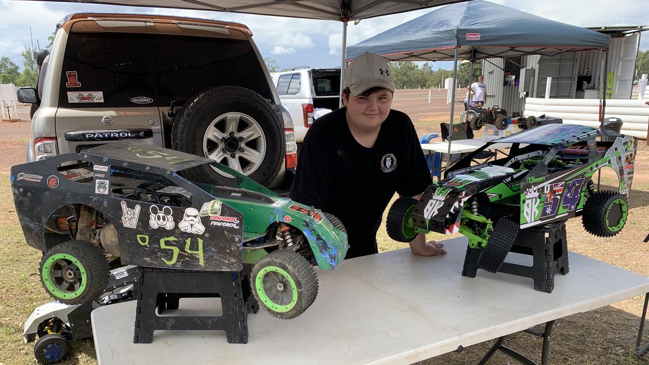 Cooper Olsen with his two cars. On the left his first car, and on the right his new car. Photo: Stuart Fast