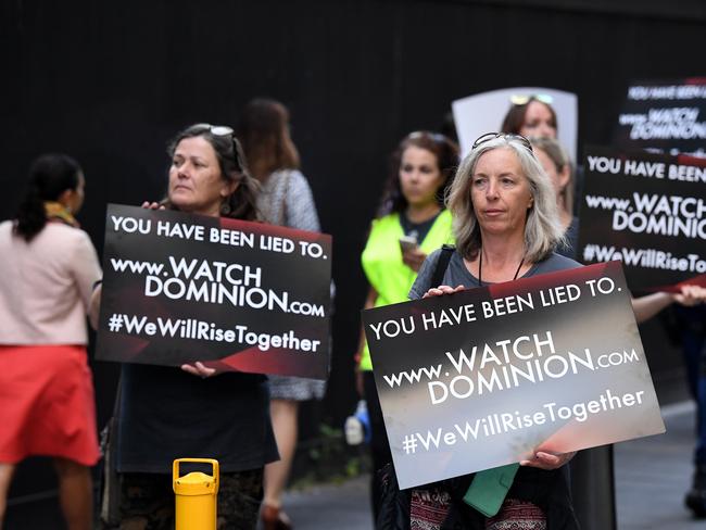 Animal rights protesters march through the business district in Sydney. Picture: AAP