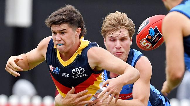 Sturt's Sam Colqhoun tackles Adelaide's Ned McHenry. Picture: Tom Huntley