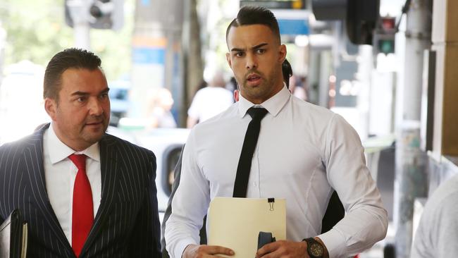 Aaron Purvis (right) arrives at the Melbourne Magistrates Court in Melbourne.